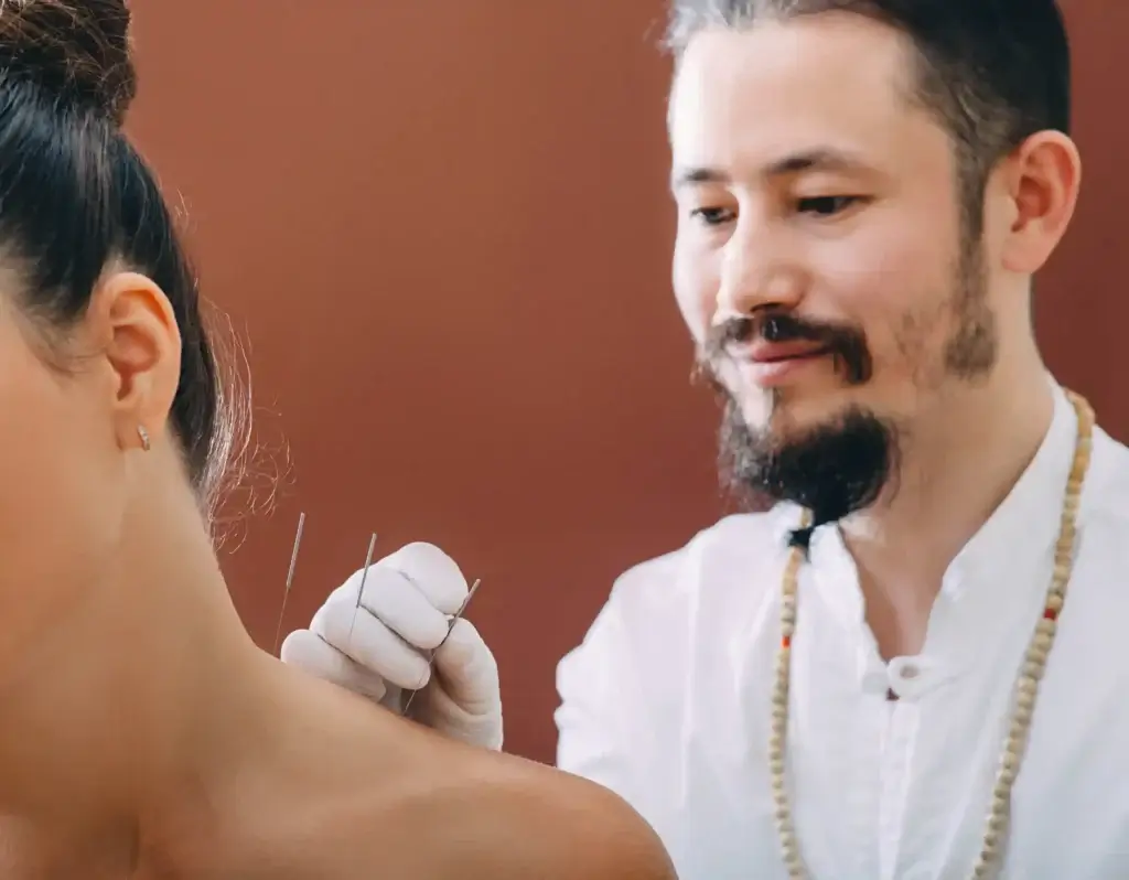 Acupuncture for Stress & Anxiety: How It Works + What to Expect 4 Patient relaxing during acupuncture session for stress relief